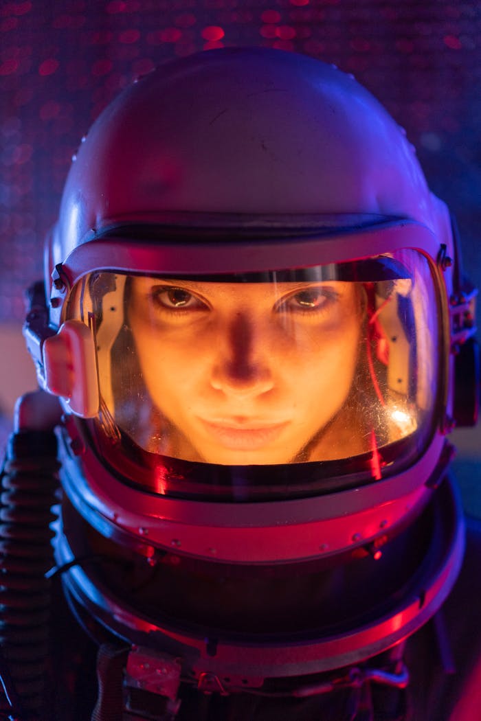 A focused female astronaut in a futuristic space suit, ready for interstellar exploration.